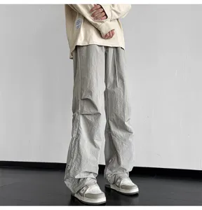 Pantalón paracaídas gris casual para hombre y mujer, pantalón cargo holgado de streetwear.