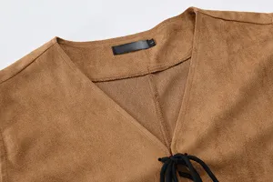 Detail view of men's brown faux suede vest V-neck with black lace-up string and size label.