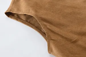 Close-up detail of men's brown suede vest showing fabric texture, armhole stitching and quality.
