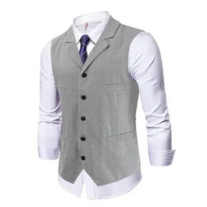 Men's business grey herringbone suit vest paired with white long sleeve shirt for formal wear.
