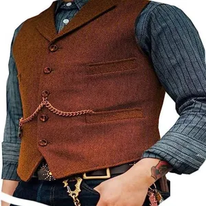 Men's vintage herringbone tweed waistcoat close-up showing pocket watch chain detail.