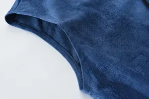 Close up view of blue fleece vest detail, showing soft fabric texture and neat stitching.