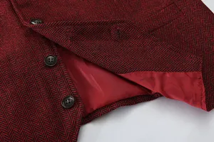 Close-up detail of men's red black herringbone suit vest showing texture and button design.