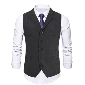 Close-up detail of dark grey herringbone suit vest lapel and buttons texture craft view.