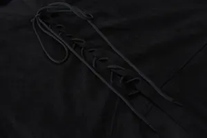 Close-up detail view of black men's casual vest with front lacing and soft texture.