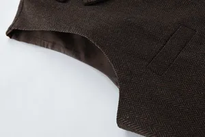 Men's retro brown herringbone suit vest detail view, showcasing premium tweed fabric texture.