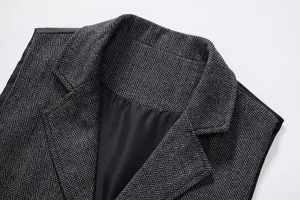 Men's herringbone tweed suit vest detail shot, vintage lapel sleeveless waistcoat for men.