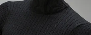 Detailed view of black men turtleneck sweater cable knit texture close up autumn winter apparel