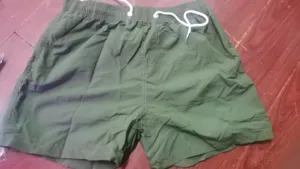 Short de plage homme couleur unie bermuda de bain decontracté été taille cordon élastique vert.