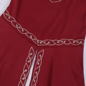 Medieval vintage dress detail featuring exquisite silver embroidery on deep red fabric.