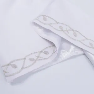 Medieval vintage dress detail white fabric with elegant silver vine embroidery trim