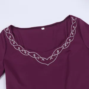 Detailed view of the medieval vintage dress neckline featuring elegant silver embroidery design.