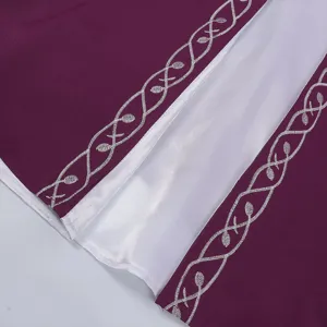 Medieval renaissance dress detail shot featuring intricate silver vine embroidery on purple fabric.