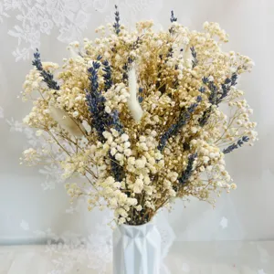 Dried flower bouquet with gypsophila and lavender details for home decoration setup.