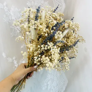 Dried flower bouquet detail featuring mixed white baby's breath and lavender stems for decor.