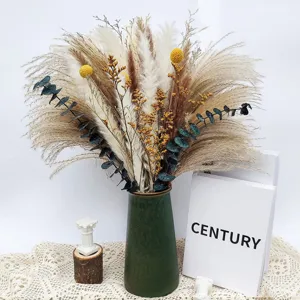 Dried flower bouquet detail showcasing natural pampas grass, eucalyptus and golden balls.