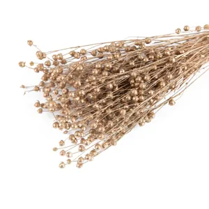Detalle de rama de flor seca dorada, ramo botánico natural para decoración del hogar casa.