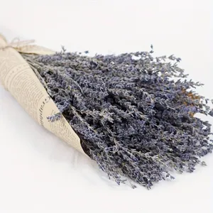 Dried lavender bouquet detail, vintage newspaper wrapping, elegant home decor prop close-up