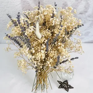 Close-up detail of dried baby's breath and lavender bouquet for cozy bohemian home decor.