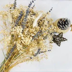 Closeup detail of mixed dried gypsophila lavender bouquet bohemian home decor arrangement.