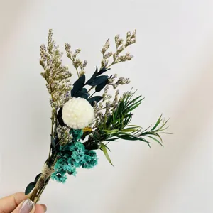 Detailed shot of a mini dried flower bouquet with natural preserved plants and decor.