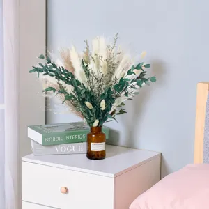 Nordic dried pampas grass bouquet with glass vase for home decor and wedding arrangement.