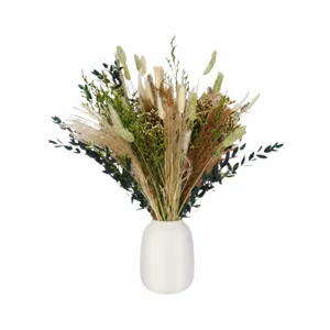 Bouquet de fleurs séchées de pampa naturelle avec vase en céramique blanche pour déco.