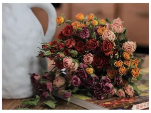 Detailed view of dried rose flower bouquet, vintage multi-color floral arrangement for home decor.