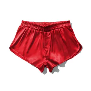 Men's red satin shorts detail view, smooth silk lounge wear, comfortable elastic waist.
