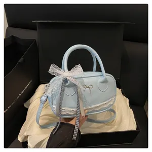 Borsa Boston in pizzo con fiocco azzurro chiaro da donna, elegante borsa a tracolla dolce.