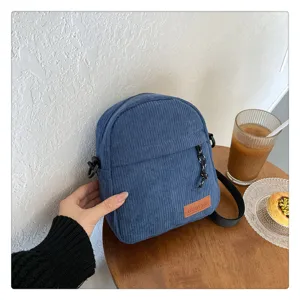 Blue corduroy crossbody bag for women, trendy daily shoulder commuting bag with stylish design.