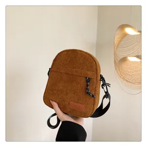 Brown corduroy crossbody bag for women, trendy daily casual shoulder bag with zipper.