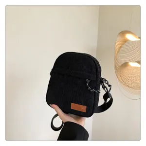 Black corduroy small crossbody bag, casual single shoulder daily commuter handbag.