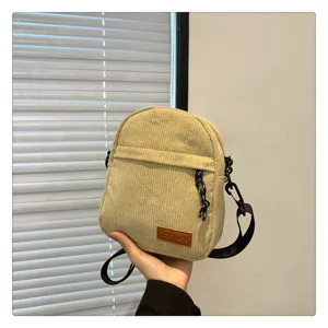 Corduroy crossbody bag for women, trendy casual single shoulder bag with zipper and strap.