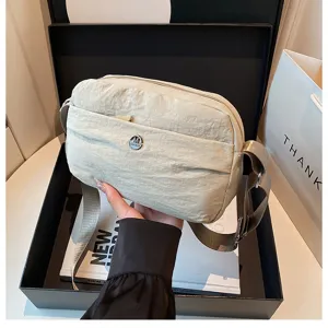 Casual minimalist nylon crossbody bag for women, lightweight multi-layer shoulder handbag.