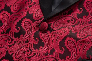 Close-up detail of red and black jacquard suit jacket, showing paisley pattern and satin lapel.