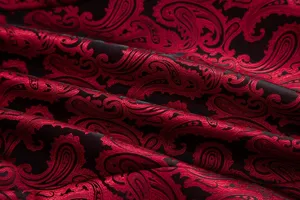 Detail shot of red and black paisley jacquard fabric for men's fashion blazer and suit.
