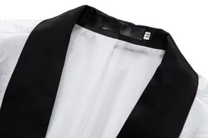 Detail view of men's white jacquard suit jacket featuring a classic black shawl lapel.