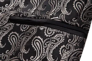 Close-up detail of men's black and silver paisley jacquard suit jacket pocket trim design.