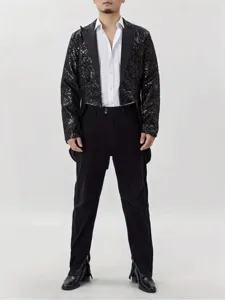 Close-up view of the black sequin tailcoat showing glittering details and formal stage design.