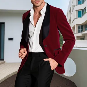 Burgundy velvet blazer detail showing black shawl lapel, white shirt, and refined tailoring.