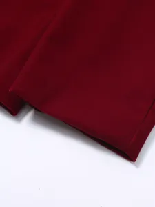 Close-up detail of wine red velvet fabric for men suit, premium texture and neat stitching.