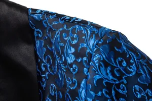 Close-up detail of men's elegant jacquard suit jacket with black satin shawl lapel.