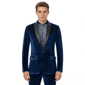 Detail view of a men's blue velvet blazer featuring satin lapels and a patterned inner shirt.