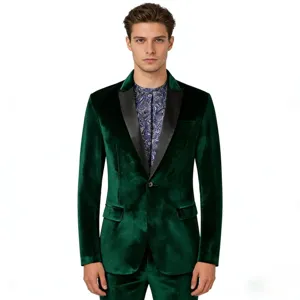Close-up of men's dark green velvet suit jacket with black satin lapel and paisley shirt.