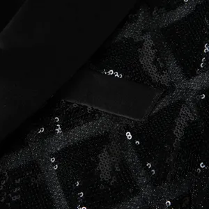 Close-up detail of black sequin men blazer jacket fabric with stylish geometric block pattern.