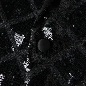 Close-up detail of mens sequin suit jacket showing textured square pattern and button.