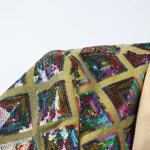 Close-up of men's shiny colorful sequin blazer fabric detail, showing sparkling texture and lining.