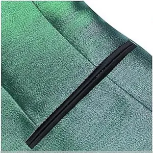 Close-up detail of green metallic men jacket fabric with black pocket trim and neat stitching.