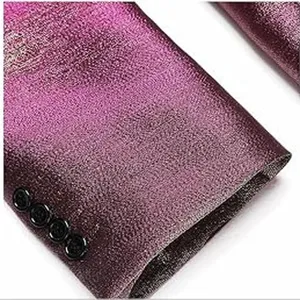 Close-up of men's metallic gradient purple suit jacket sleeve cuff with four black buttons.